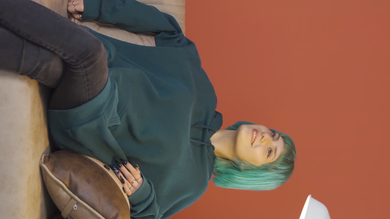 Vertical video of Young woman nodding in a positive way.