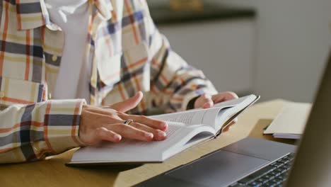 person reading a book at a desk