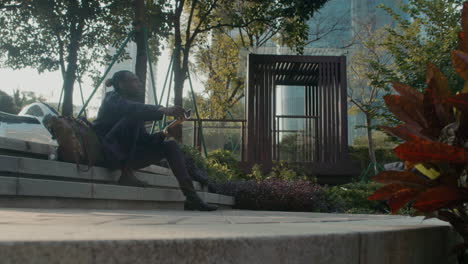 artist looking for inspiration outdoors in park, guangzhou, china