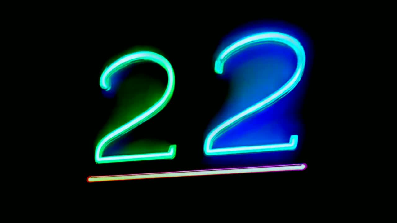 Neon light number 22 twenty two sign symbol on black background modern for video elements