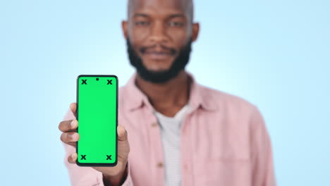 Green-screen,-closeup-and-man-with-phone-in-studio