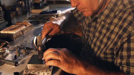 goldsmith preparing ring