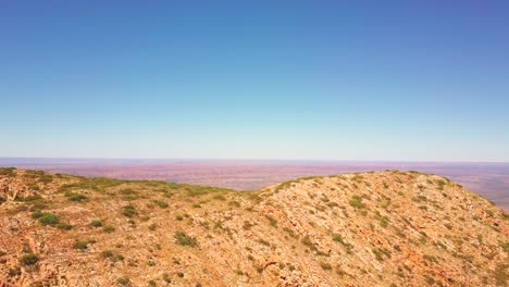mt sonder - central australia. cinematic aerial flyover revealing a vast flat landscape. filmed on dji mavic pro.