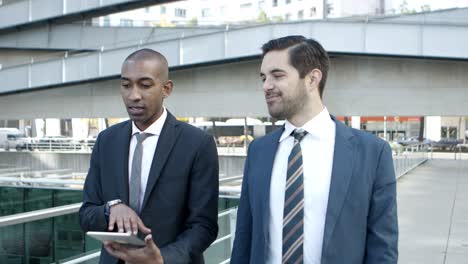 multiethnic businessmen with digital tablet