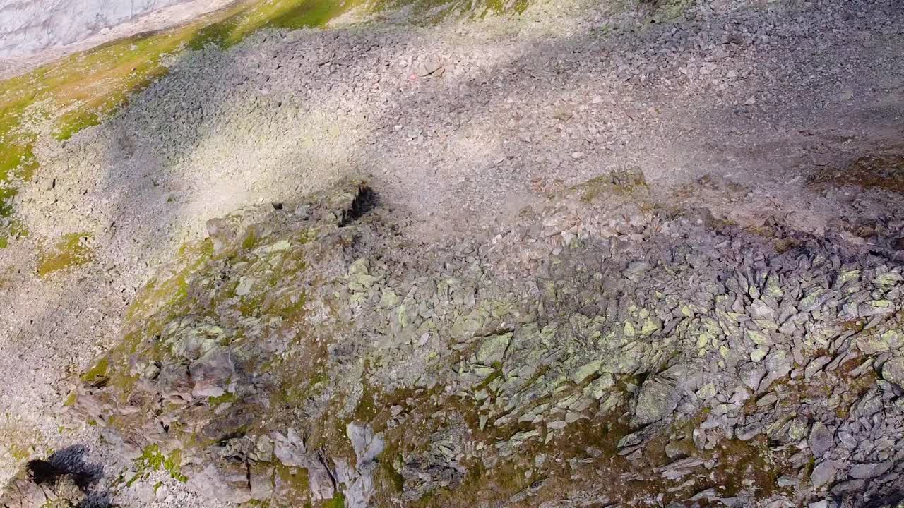 Top down aerial view of Scenic rocky mountain cliffside near the aletsch glacier in Switzerland