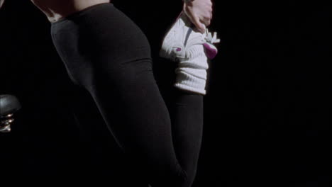 a woman stretching out at the gym