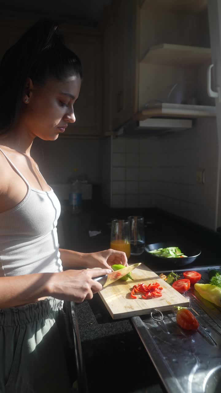 Woman Preparing a Salad in the Kitchen
