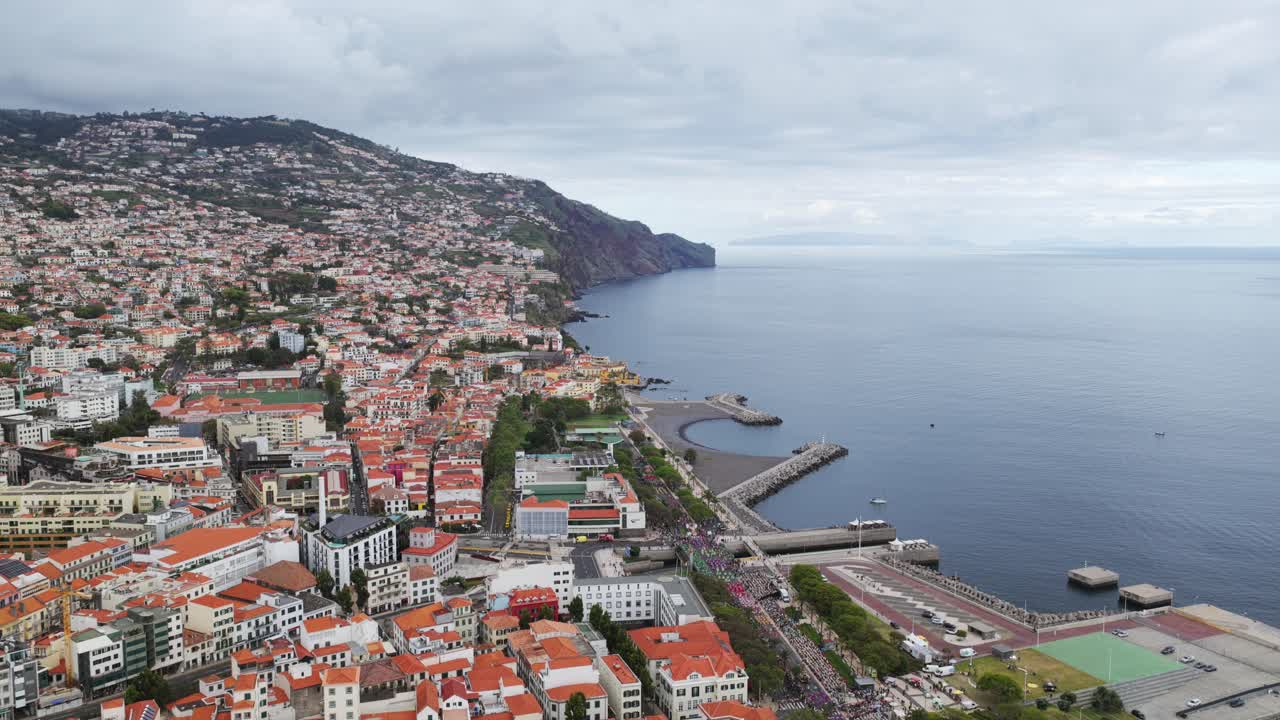 Funchal, Madeira, Portugal, exploring the city from above, enjoying the breathtaking aerial view of the coastline. Aerial, Dolly Back