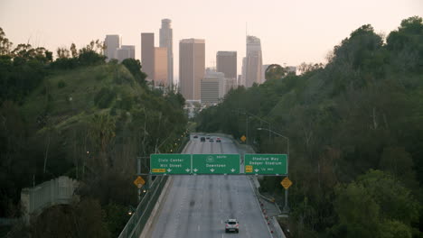 los angeles 110 freeway leading to downtown skyline