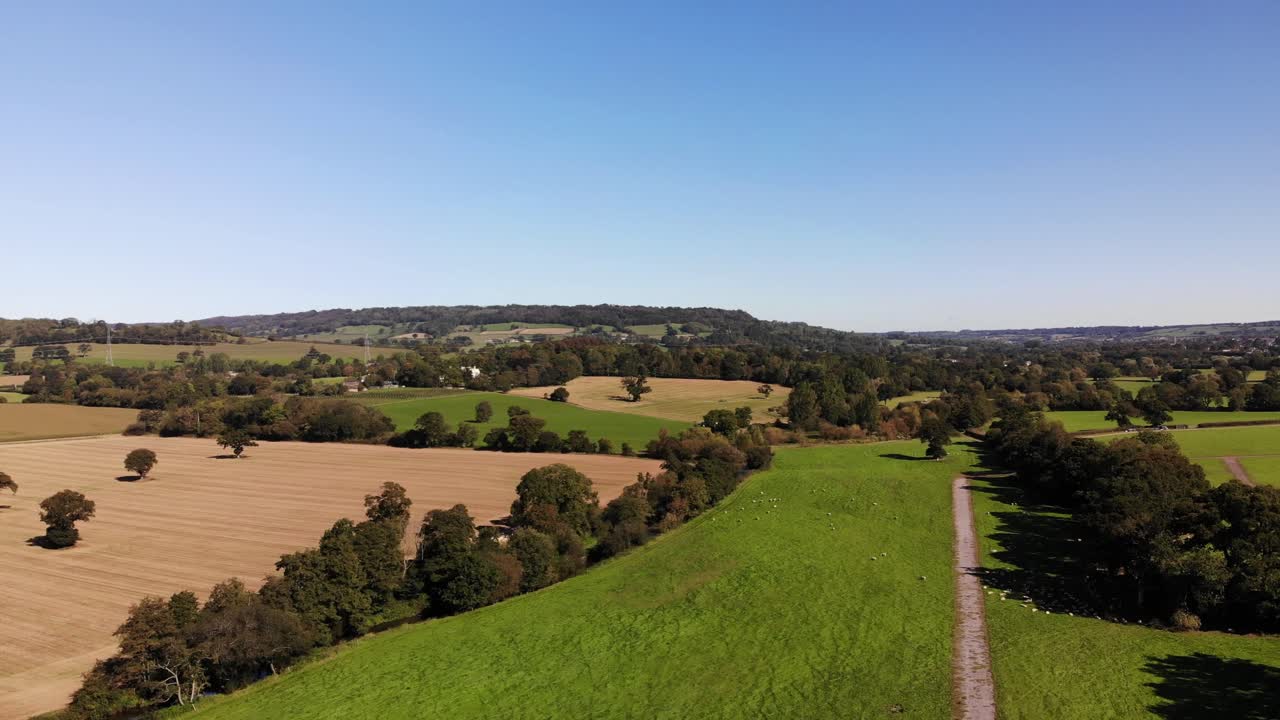 Aerial backwards shot over Devon Countryside on a beautiful summers day