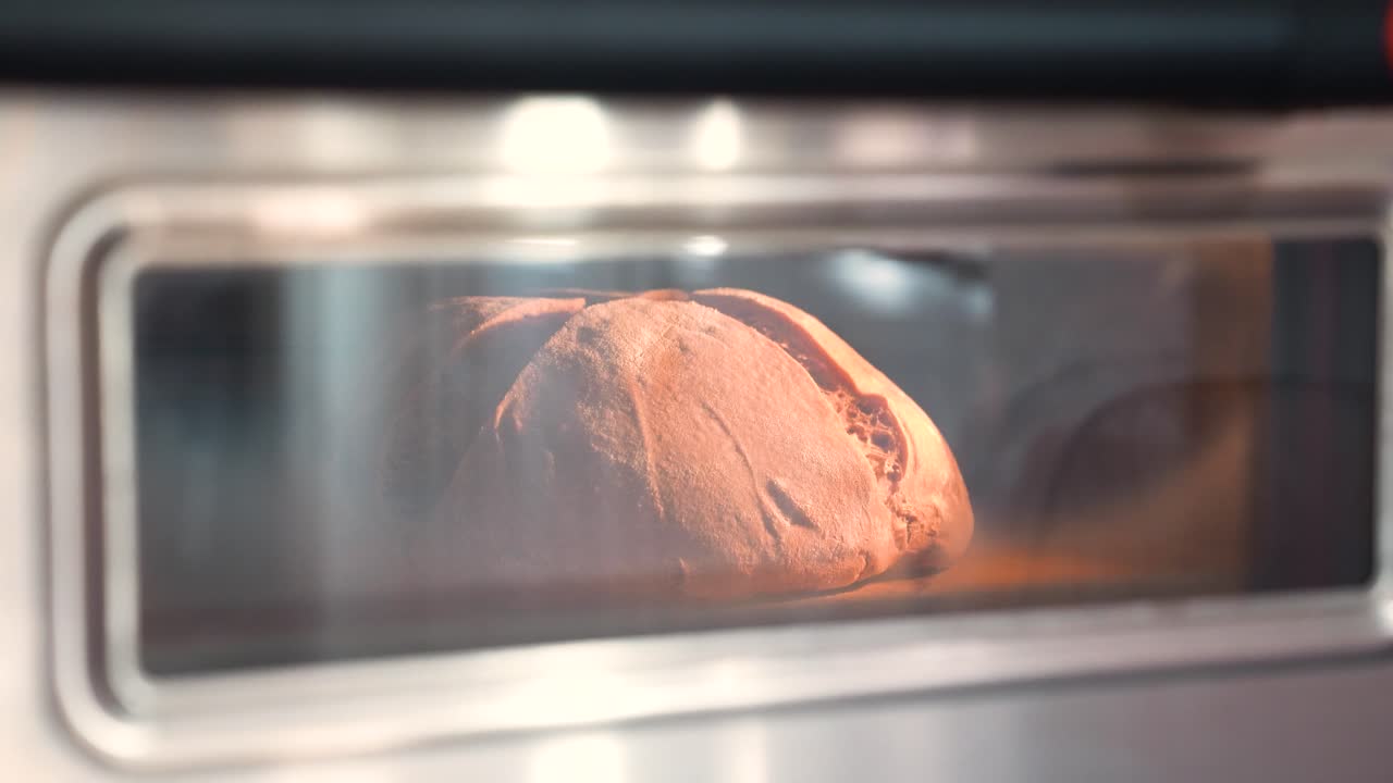 Bread rising in an industrial oven, timelapse shot