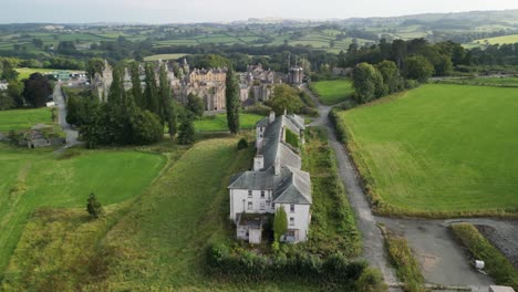 haunted denbigh lunatic asylum, north wales, nurses quarters, aerial anticlockwise rotate from far, sunny afternoon