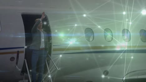 animation of network of connections over caucasian businessman waving