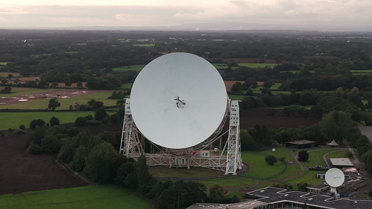 The Lovell Telescope at Jodrell Bank Observatory surrounded by green fields