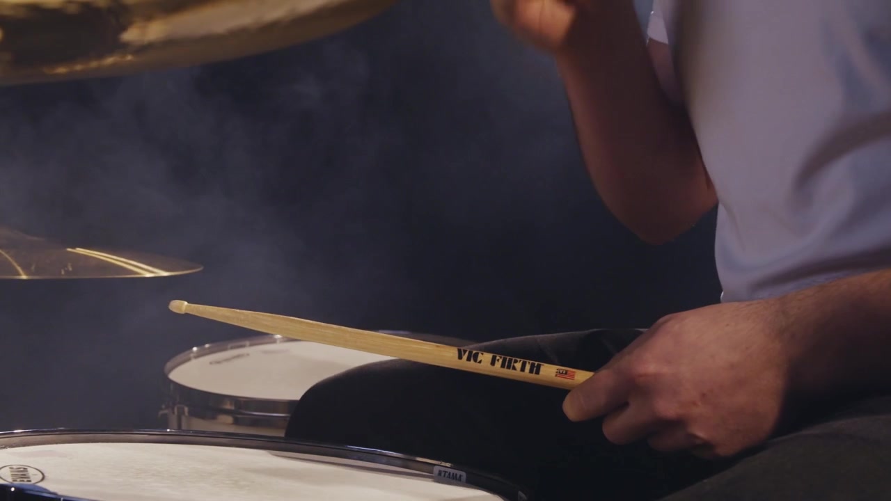Man plays drums on stage 4K