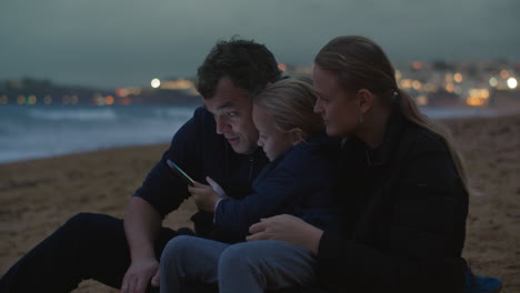 Family-night-at-ocean-shore