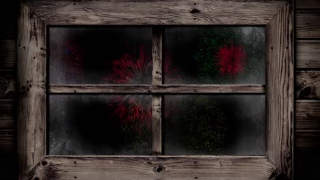 Animation-Des-Fensters-Mit-Bunten-Weihnachts--Und-Neujahrsfeuerwerken,-Die-Am-Nachthimmel-Explodieren