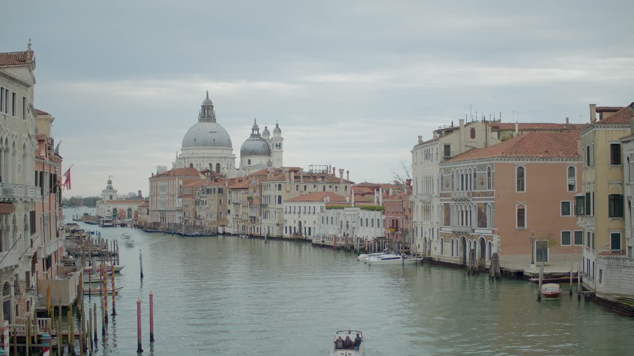 Ferryboat Cruising Grande Canal With Historical Buildings Around In Lovely Touristic Venice, Italy