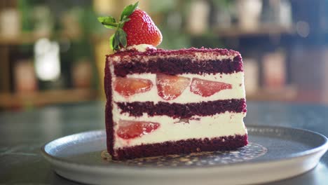 a slice of red velvet cake with strawberries