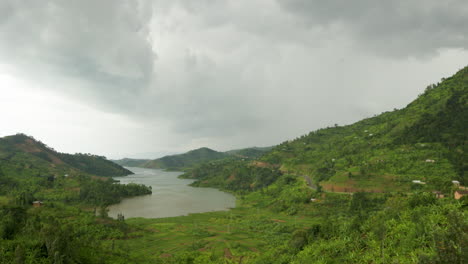 camera pans left of lake and mountains in rwanda