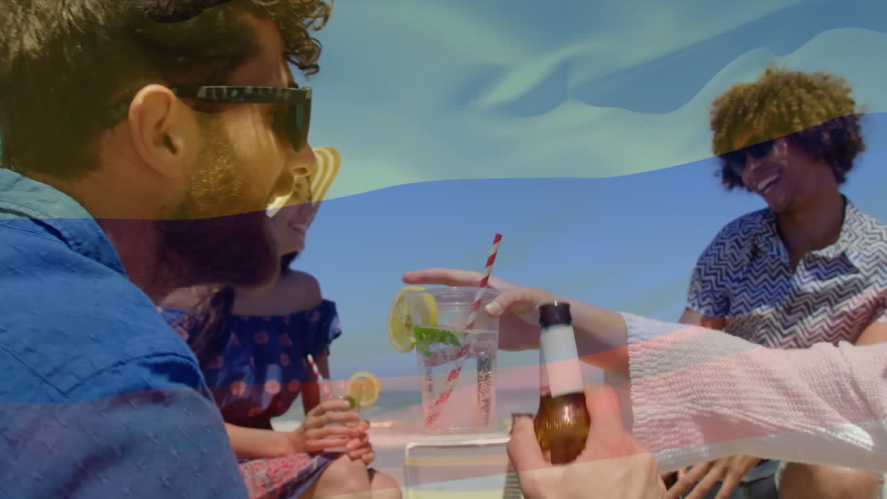 해변에서 즐겁게 지내는 친구 그룹 위에 콜롬비아의  ⁇ 발을 흔드는 애니메이션