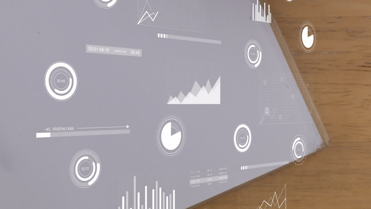 Overlaying wooden surface, graphs and charts illustrating animation of data analysis