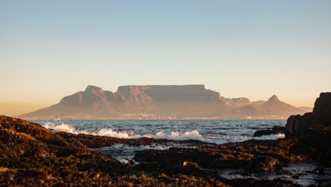 time-lapse over the ocean of table mountain while the sun is setting