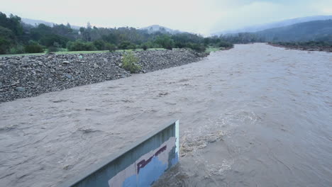 A-river-in-Southern-California-begins-to-flood-during-a-large-storm-1