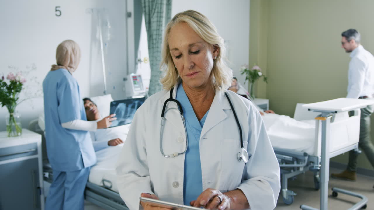 Female doctor using tablet computer in hospital ward 4k