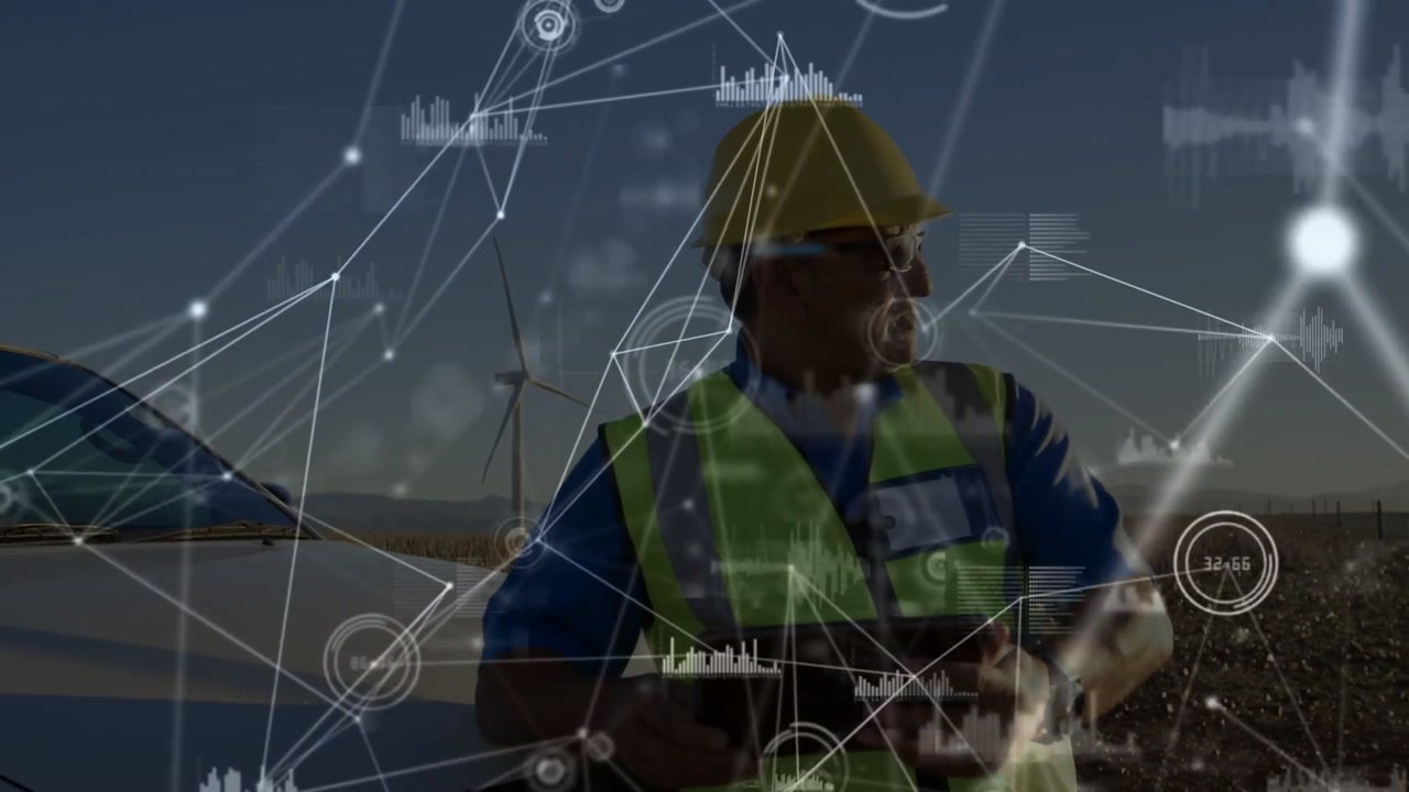 Vertical video: Field tech tapping tablet, activating nodes over turbines, monitoring systems