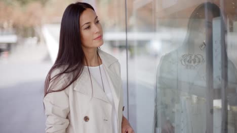 Young-woman-eyeing-an-item-for-sale