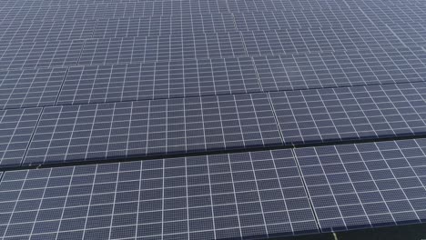 close drone shot of rows of solar panels