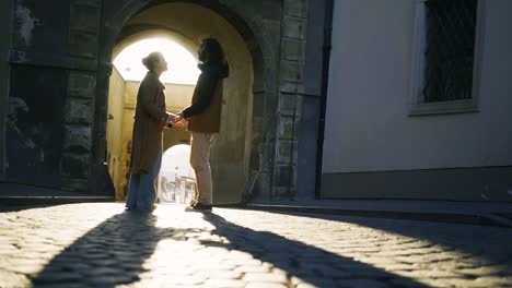 couple walking on narrow street in prague castle