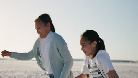 girl children, holding hands and running in beach