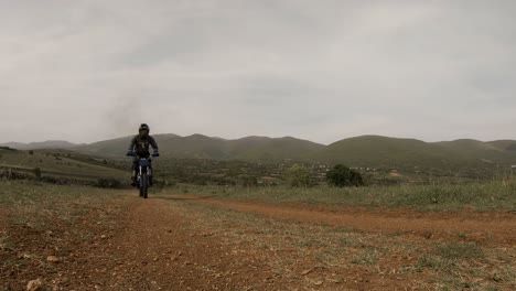 dirt cross bike rider passing on an off road trail