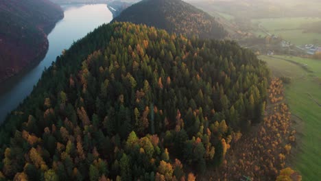 drone-aerial,-Autumn-landscape,-peaceful-valley,-hill-and-river,-evening