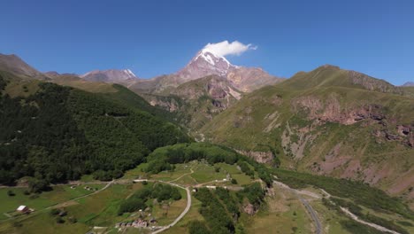 aerial pullback reveals mount kazbek mountain landscape - amazing hyperlapse