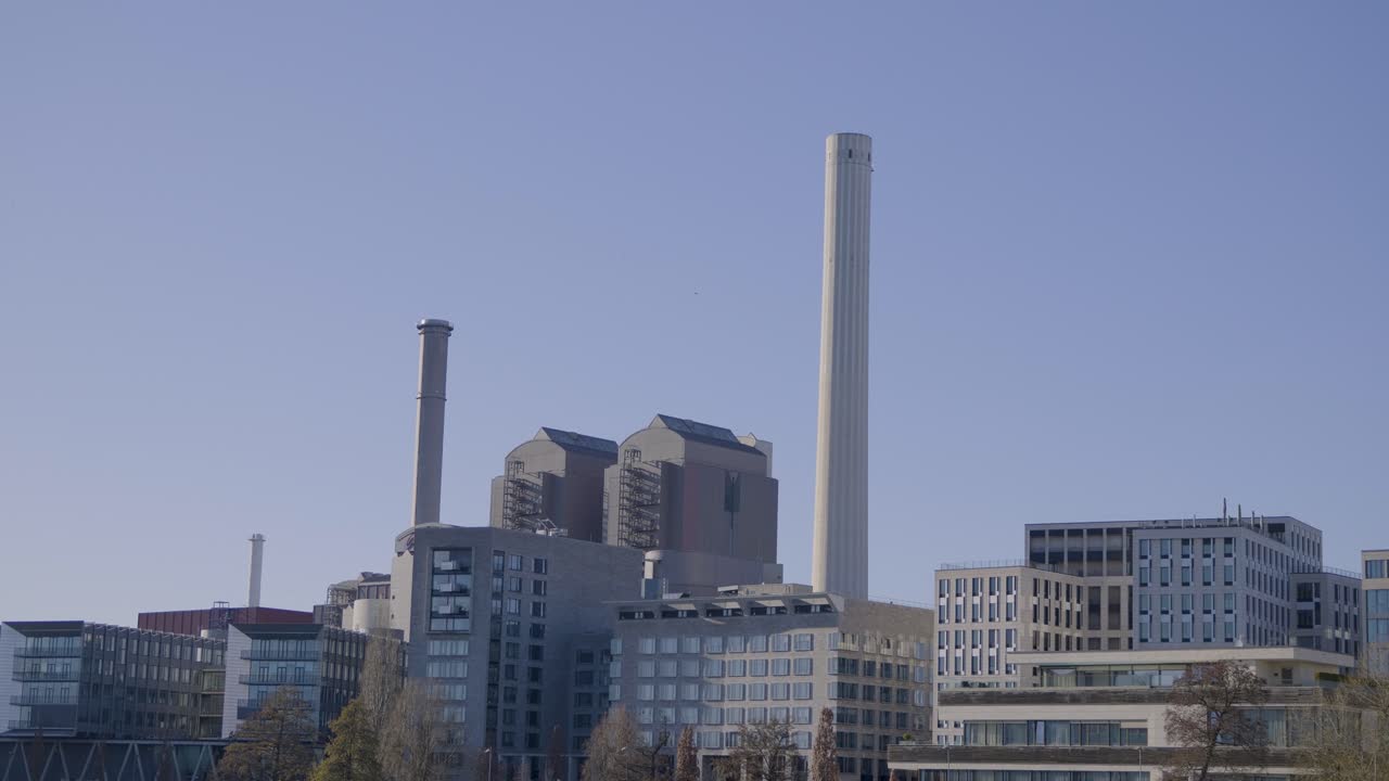 Modern cityscape with industrial buildings and smokestacks in Frankfurt am Main