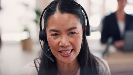 Asian-woman,-call-center-and-face-with-headphones