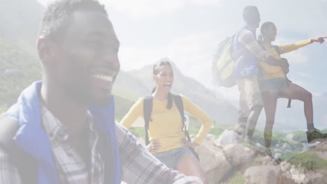 composite of happy african american couple hiking on mountain, and stopping to admire the view