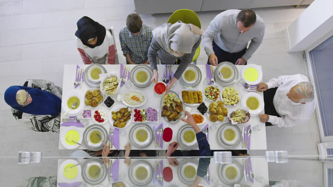 Muslim family gathering for having Iftar in Ramadan together top view
