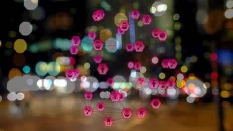 Animation-of-connected-icons-forming-globe-over-blurred-vehicles-moving-on-street-in-city