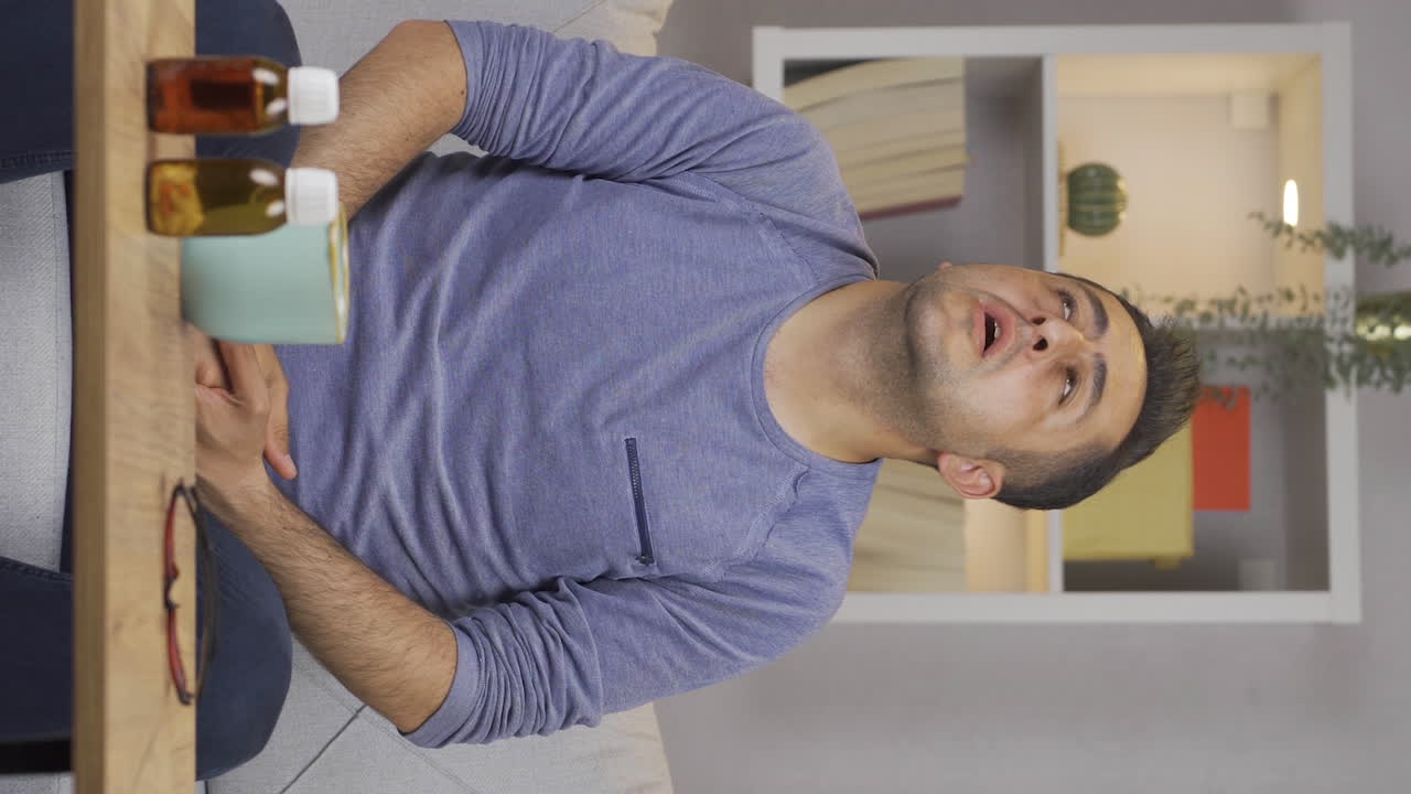 Vertical video of Sick man with rapid breathing. The man cannot control his breathing.