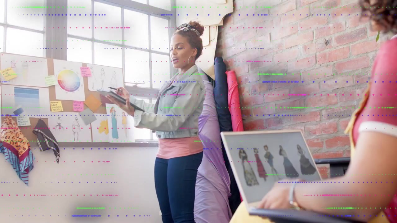Standing woman tapping tablet and pointing at corkboard, animated swatches aiding fashion choices