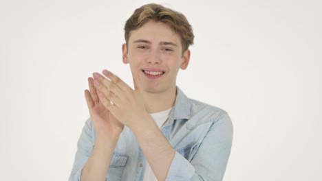 young man clapping, applauding on white background