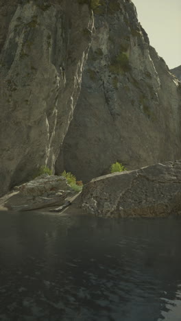 a serene view of a river flowing through a rocky mountain landscape