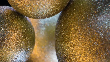 close-up of golden glitter balls