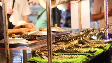 crocodile meat prepared at bustling night market