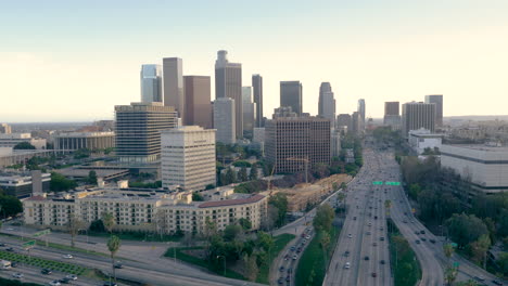 aerial view of los angeles freeway interchange with cityscape and traffic