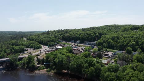 close-up panning aerial shot of taylors falls, minnesota along the saint croix river